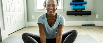 a black woman doing yoga